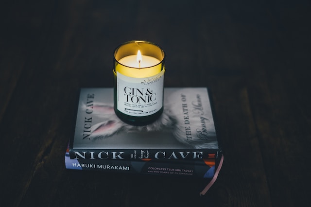 Candle on pile of books