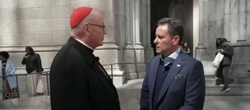 A photograph capturing Brian Kilmeade and Cardinal Dolan outdoors