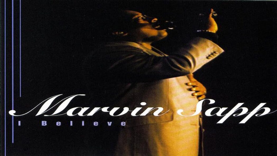 Album cover featuring Marvin Sapp singing, holding a microphone, and wearing a white coat against a dark background