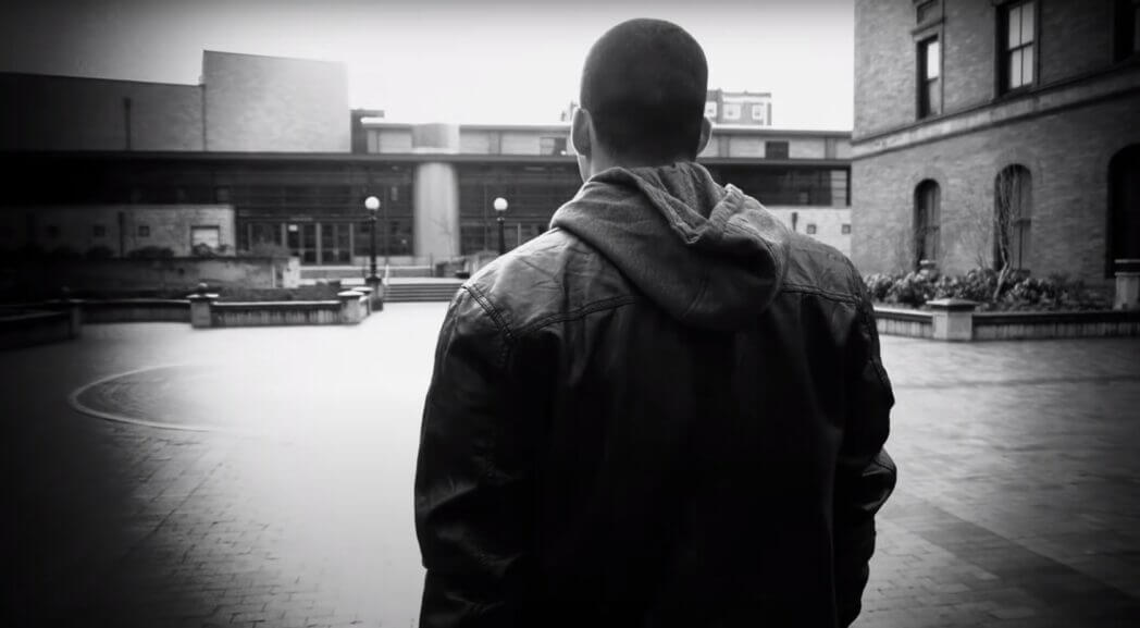 a black-and-white shot of Jefferson Bethke from the back walking somewhere outside