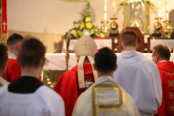 catholic bishop with people at a church