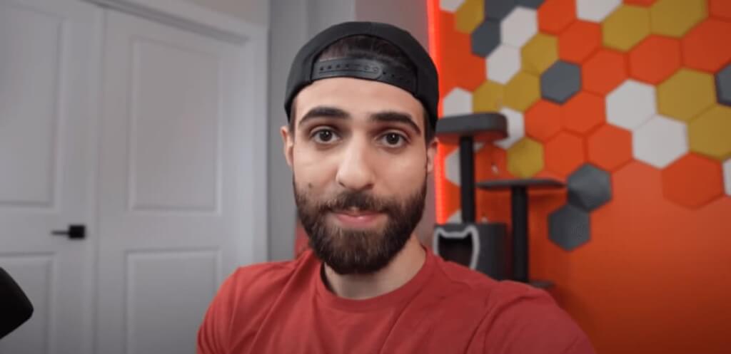 SypherPK facing the camera while wearing a reversed cap