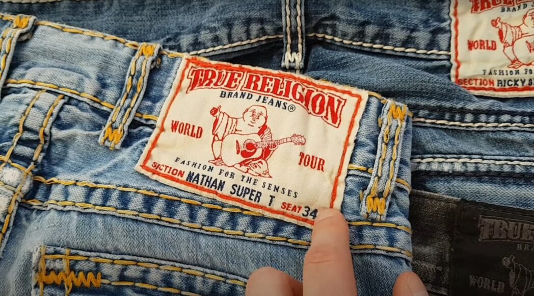 a patch/logo on the back of the TR jeans